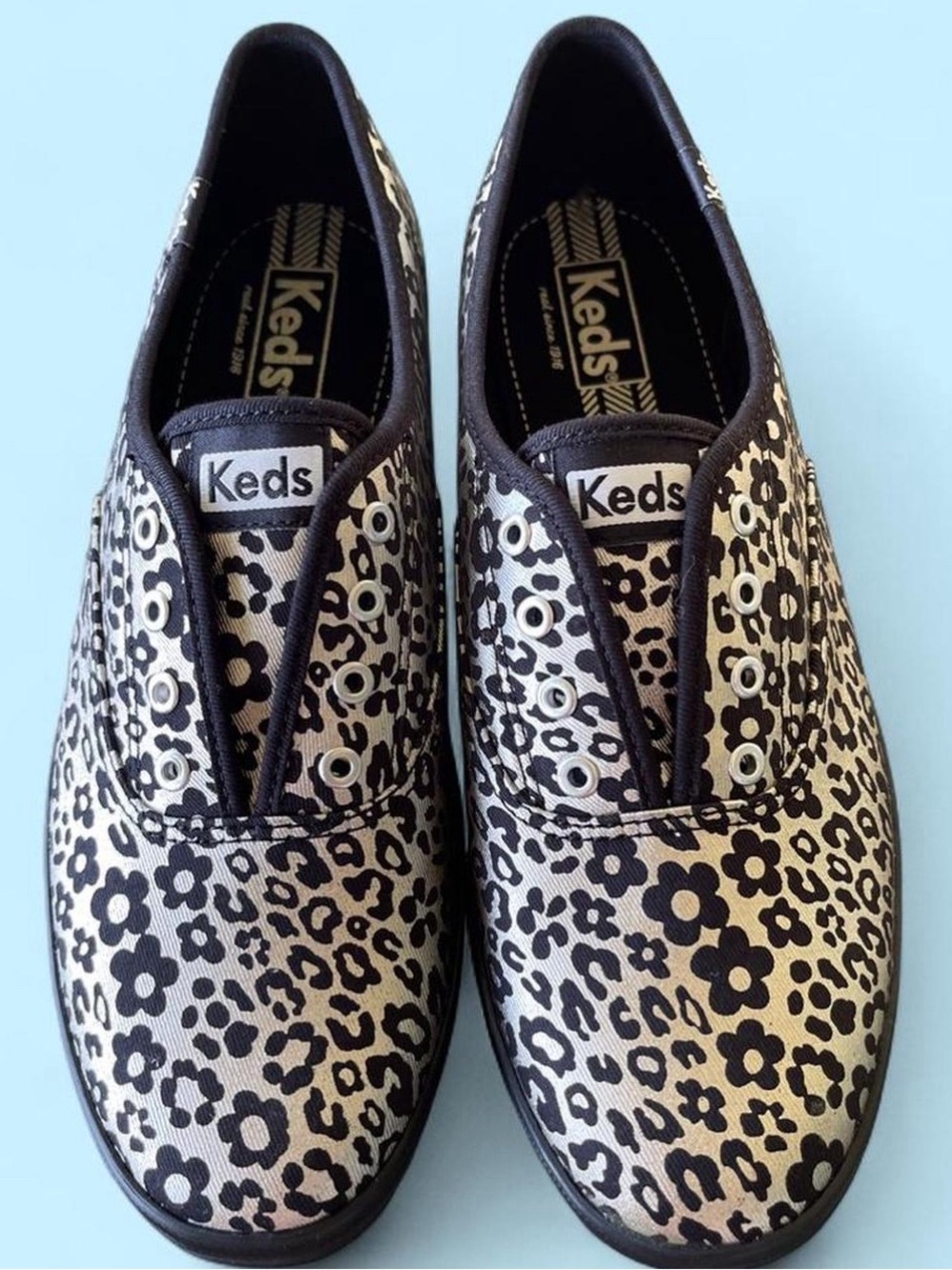 Keds Slip-On Floral Leopard Print Sneakers in Black and Gold